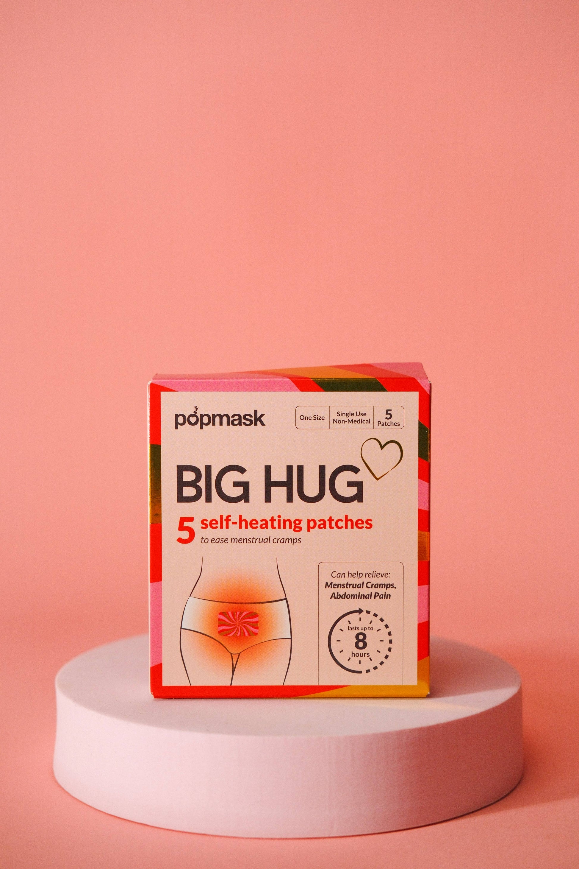 Box of popmask Big Hug self-heating patches on a pink background