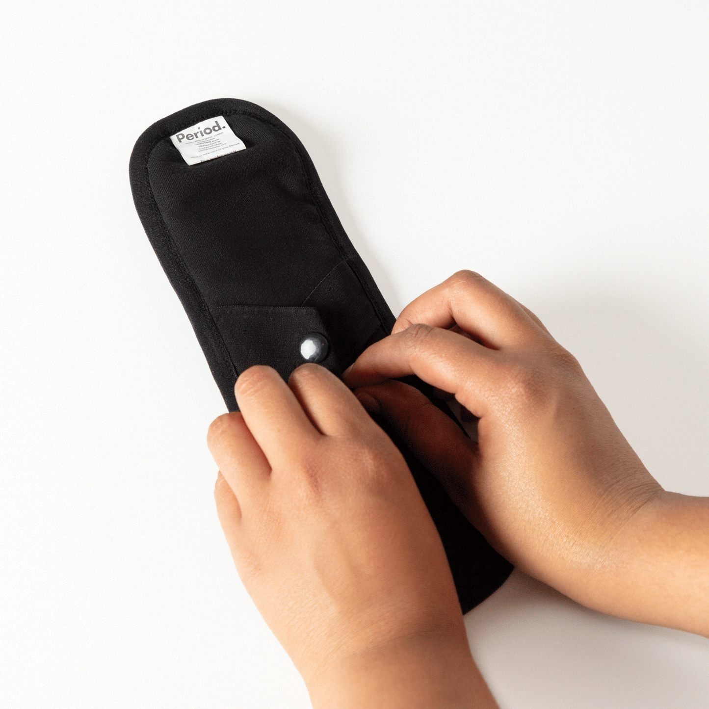 Black cloth period with snapping feature