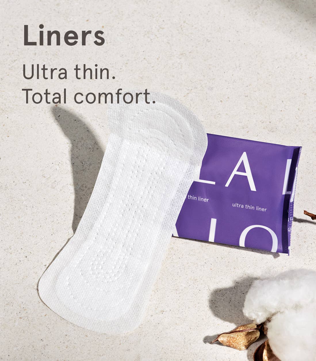 White sanitary liner with a purple package labeled 'LOLA' on a light background.