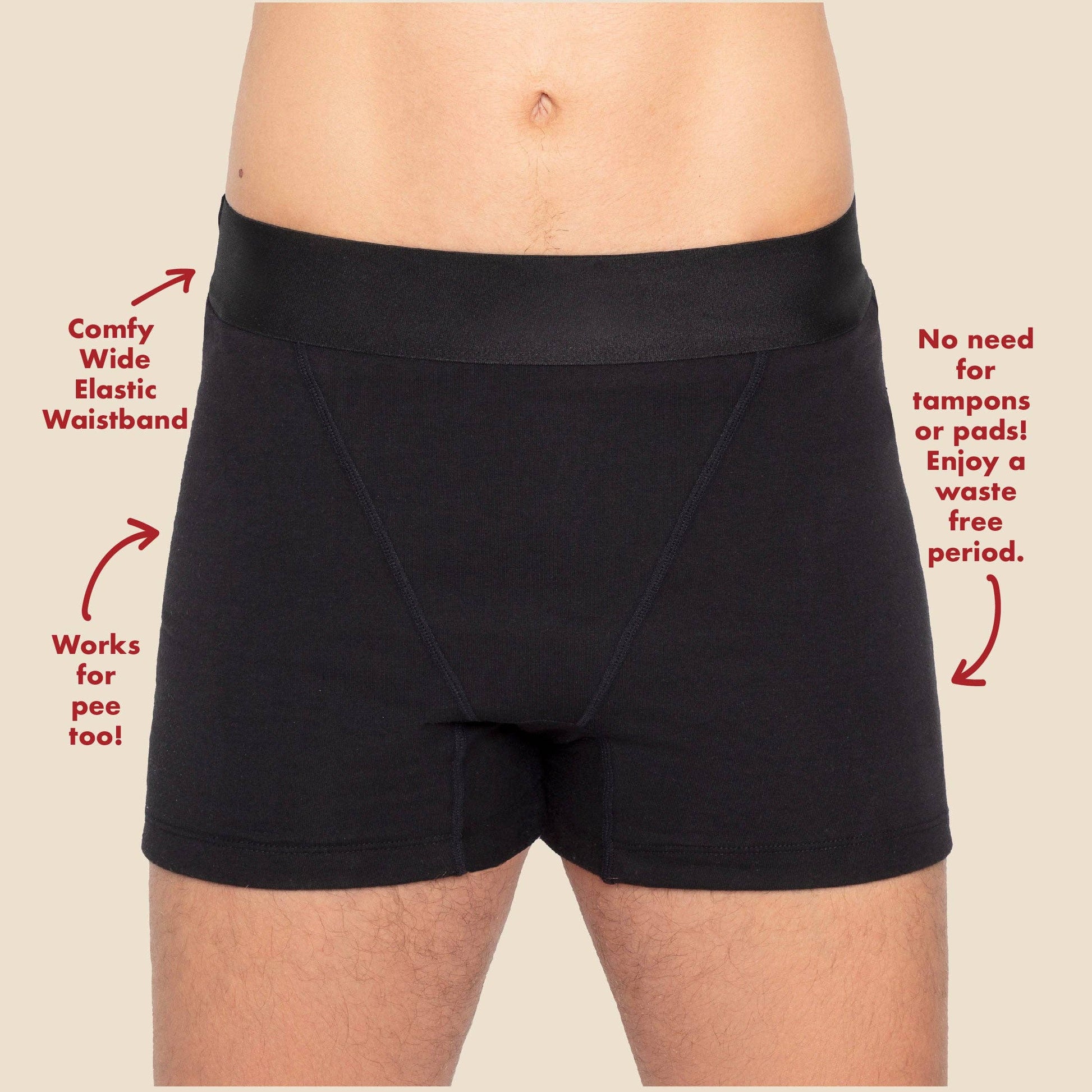 Comfy black organic period shorts on a beige background
