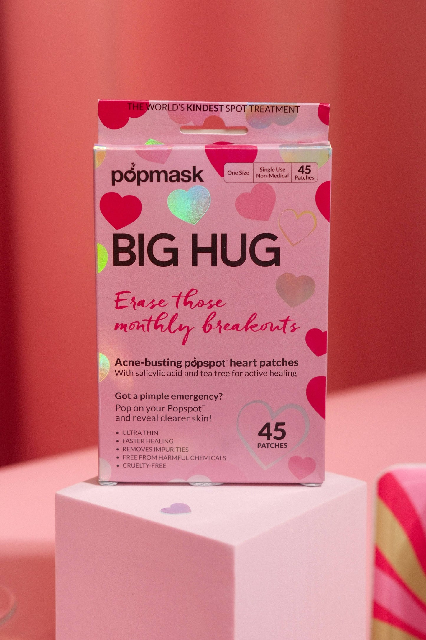Box of popmask Big Hug heart-shaped acne patches on a pink background