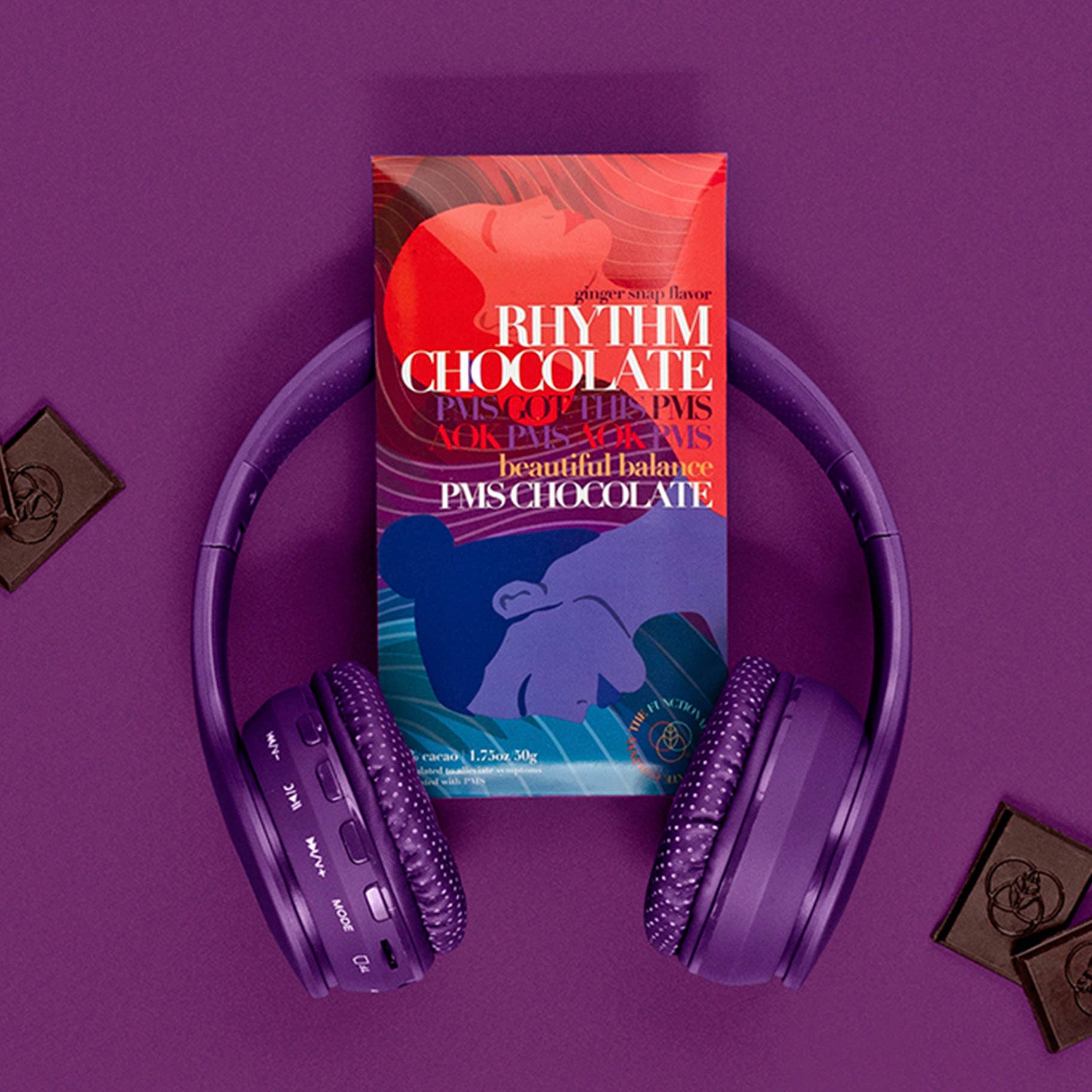 Purple headphones on a purple background with a Rhythm Chocolate bar
