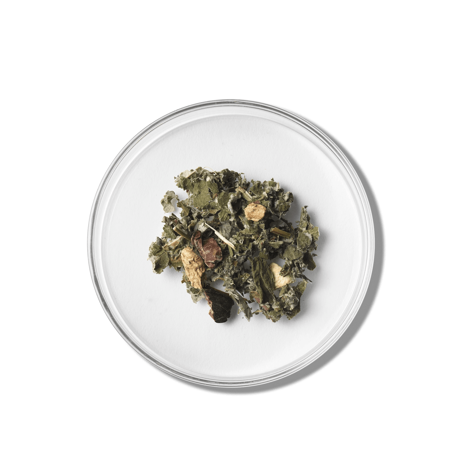 Raspberry Leaf Herbal tea leaves on a white plate with a green background